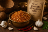 create hd image of dry coconut garlic chutney on attractive bowl with Konkani tradition surrounding along with written on Spruha’s Gharguti lasun khobra chutney on packet