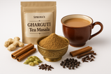 Make hd image of tea masala in a brass bowl with tea in a attractive cup surrounded with dry ginger, cinnamon, cardamom, black pepper, cloves with white background, packet written on Spruha’s Gharguti Tea masala